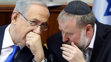 Netanyahu, left, with Avichai Mandelblit back in December 2015.