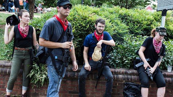 A group of antifa activists rest during a rally in Charlottesville, Virginia. 