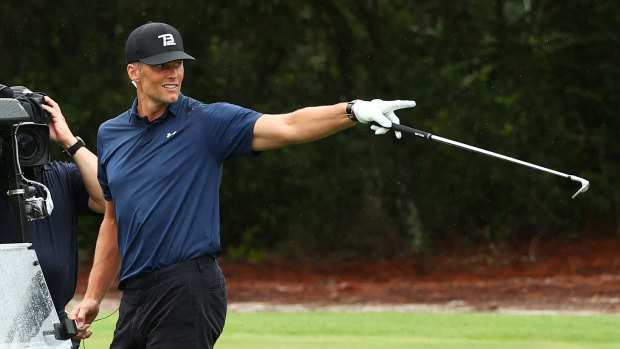 Tom Brady celebrates after his spectacular shot on the seventh hole during The Match: Champions for Charity.