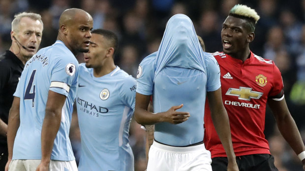 Settle down: Manchester United spoiled cross-town rivals City's party.