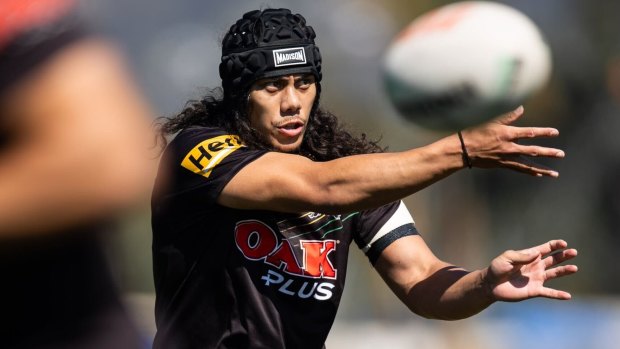 Jarome Luai tests out his shoulder at Panthers training on Sunday.