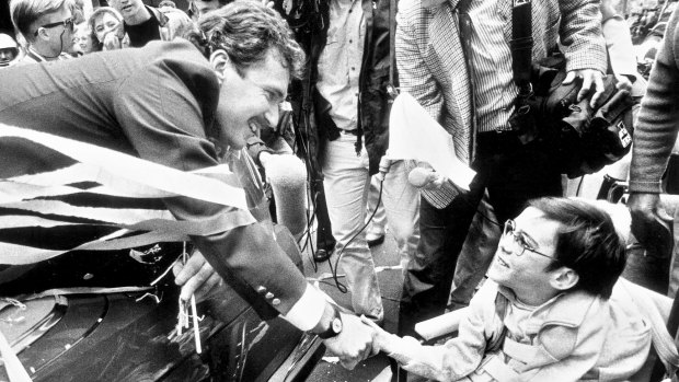 Australian captain Allan Border greets a fan in a ticker tape parade on George Street, Sydney,  28 September 1989 to celebrate Australia regaining the Ashes in England for the first time since 1934, after winning the 4th Test at Old Trafford with a comprehensive 9 wicket win. 
