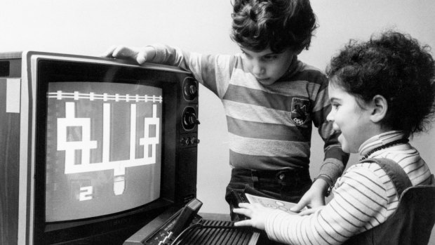 Dubbed "two of the luckiest kids" in the US, Katherine, 3, and her brother, Jesse, 8, try out new games for the Children's Computer Workshop in 1983.