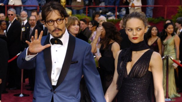 The then best actor nominee Johnny Depp and Vanessa Paradis arrive for the Academy Awards in 2005. 