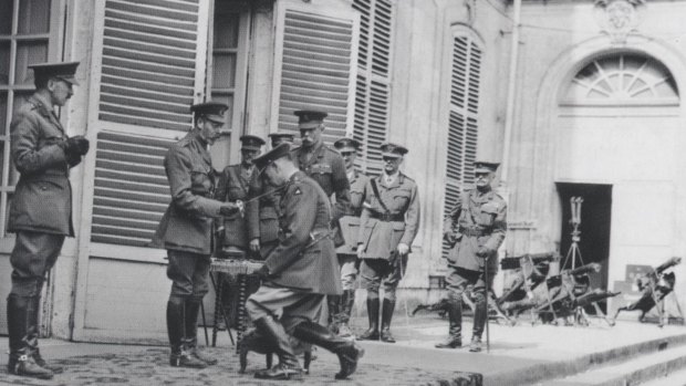 King George V knights Lieutenant-General Sir John Monash on August 8.