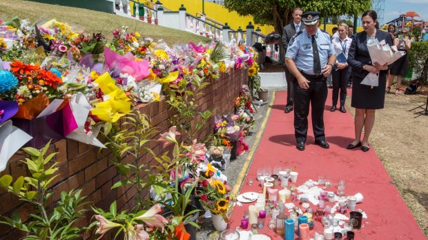 Queensland Premier Annastacia Palaszczuk and Assistant Commissioner Brian Codd pay their respects after Dreamworld disaster.