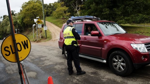 Drivers are stopped by police at the Queensland-NSW border in the Gold Coast hinterland.