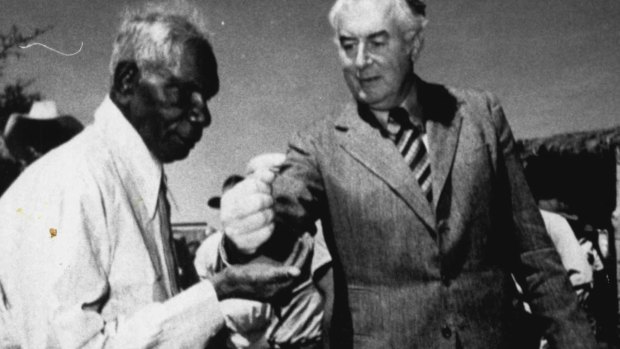 Gurindji leader Vincent Lingiari receives a symbolic handful of soil from Gough Whitlam in 1975.