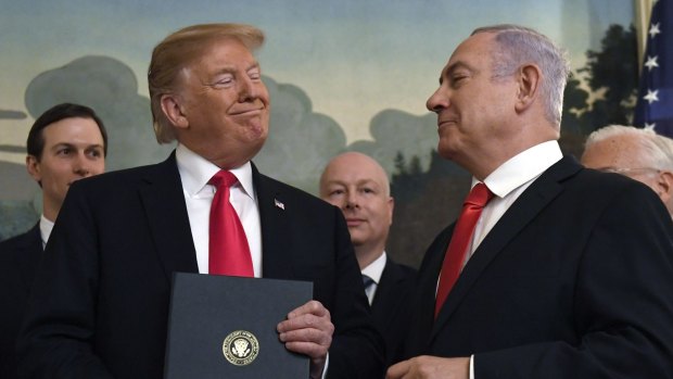 President Donald Trump smiles at Israeli Prime Minister Benjamin Netanyahu, after signing a proclamation formally recognising Israel's sovereignty over the Golan Heights earlier this year. 