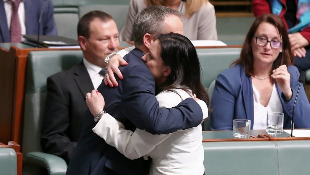 Opposition Leader Bill Shorten embraces Emma Husar after her maiden speech in parliament in 2016.