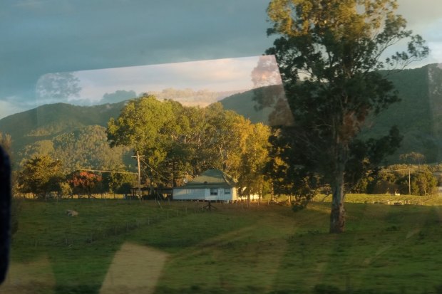 The bucolic view of the hills near Gloucester is reflected in the windows of the XPT train.