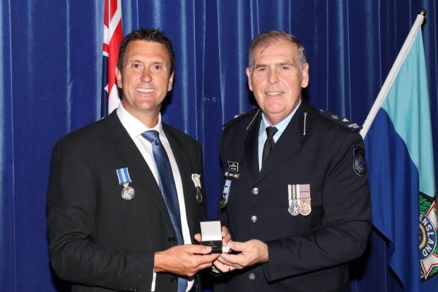 Dan Purdie receives a policing award during his time in the police service. 