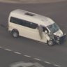 A driver climbs out a van that was pursued by police across Melbourne.