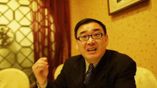 Yang Hengjun was surrounded by secret police as he waited in a queue at the airport.