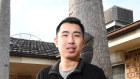Young home buyer, Edward Jiang, standing in front of his new home in Guildford.