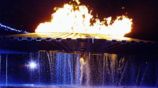 The cauldron rises above Cathy Freeman on September 15, 2000.