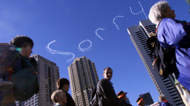 SORRY is written in the sky as demonstrators march for reconciliation.
