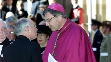 Archbishop George Pell with then prime minister John Howard in 2002. 
