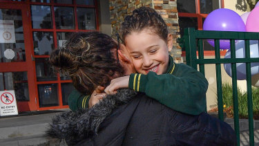 Michelle Elias and daughter Ella return to Holy Family Primary School.