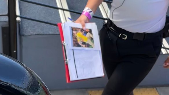 Stadium staff with a photo of Mark McLinden