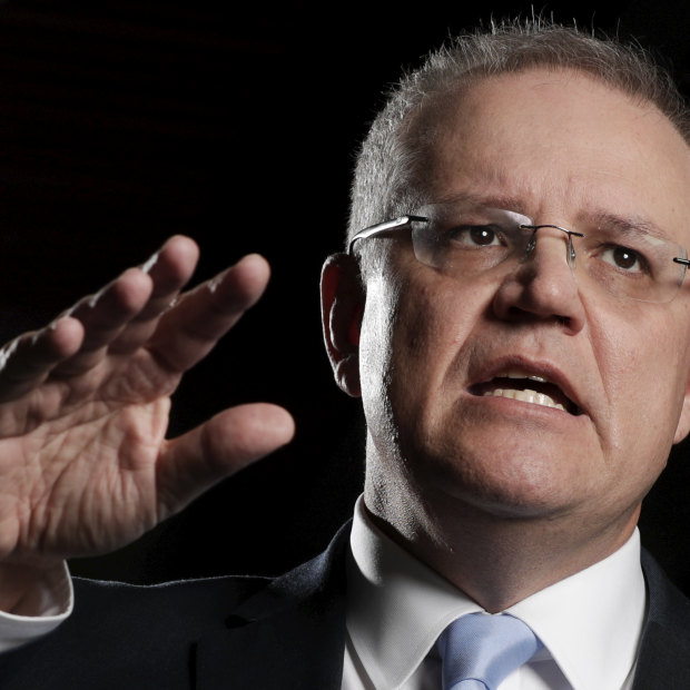 Treasurer Scott Morrison spruiks the government's income tax cut package, which passed Parliament after negotiations with the Senate crossbench. 