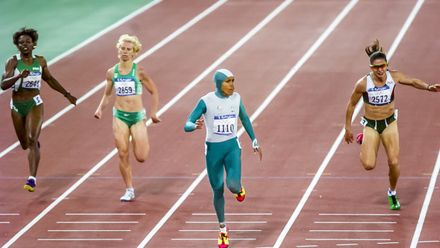 Cathy Freeman wins gold in the 400m at the Sydney Olympics.