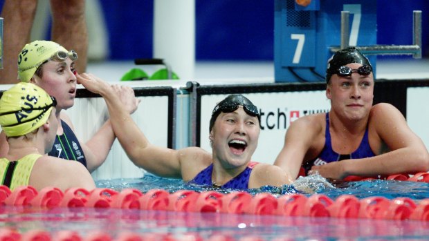 Susie O Neill and Petria Thomas watch on as Misty Hyman celebrates a stunning upset in the 200m butterfly at the Sydney Olympics.