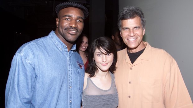 Evander Holyfield at the Last Lap, with singer Leah Haywood and American swimming legend Mark Spitz.