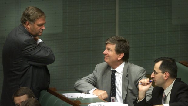Then opposition leader Kim Beazley consults with his advisors, from right, senior advisor Michael Pezzullo and chief of staff Michael Costello during question time in 2000.