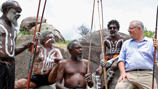 Prime Minister Scott Morrison with people of the Guugu Yimidhirr tribe at Reconciliation Rocks earlier this year.