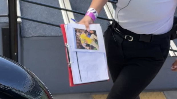 Stadium staff with a photo of Mark McLinden