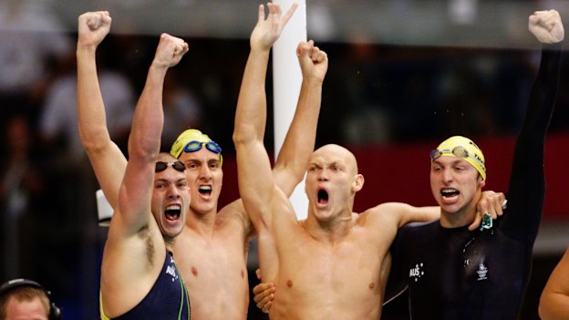 Ashley Callus, Chris Fydler, Michael Klim and Ian Thorpe celebrate their gold in the 4x100m relay. The Australians set a world record of 3:13.67 while Klim also broke the individual world record, finishing his leg in 48.18s. 
