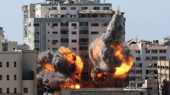 A ball of fire erupts from a building housing various international media, including The Associated Press, after an Israeli airstrike on Saturday, May 15, 2021 in Gaza City.   