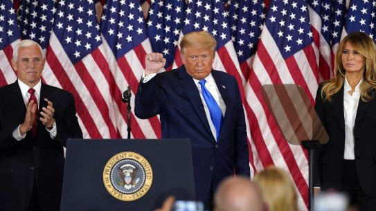 President Donald Trump pumps his fist after speaking in the East Room of the White House