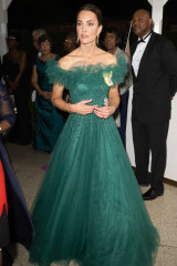 Duchess Catherine wore a custom emerald gown by British designer Jenny Packham.