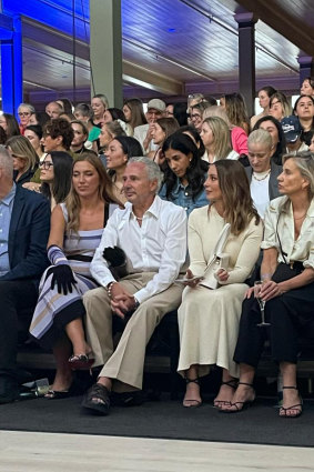 Former Telstra chief executive Andy Penn gets into the spirit of things with wife Kallie Blauhorn at Melbourne Fashion Week.