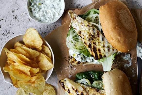 Barbecue fish burgers with potato chips. 