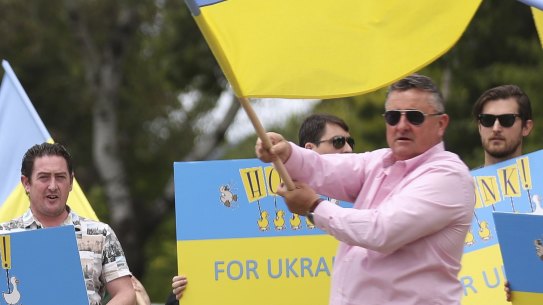 Ukraine supporters protest outside the Russian embassy in Canberra.