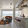 Mid century meets 21st century design in this kitchen with integrated bar by Greg Natale.
