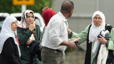 Families seen outside a mosque following a shooting at the Masjid Al Noor mosque in Christchurch.