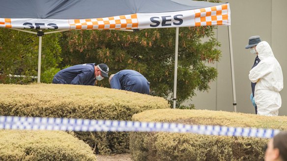Investigators examine the woman's body found in Bundoora.