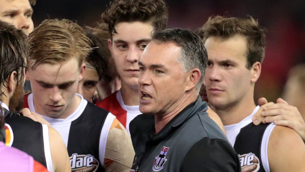 Alan Richardson speaks to his players at three-quarter time during the match against the Swans at Etihad Stadium.
