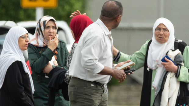 Families seen outside a mosque following a shooting at the Masjid Al Noor mosque in Christchurch.