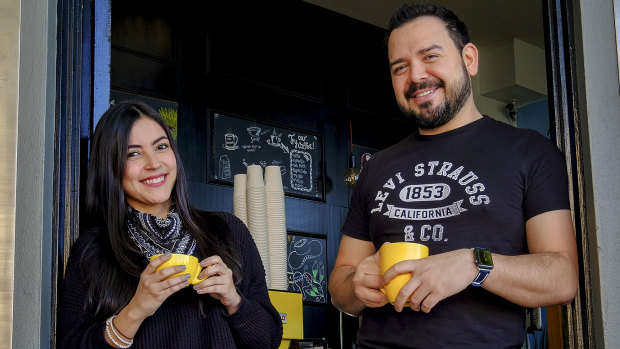 Latin Americans in Melbourne:  Isabel Arias and Diego Reyes outside Reyes' cafe Cento Mani.