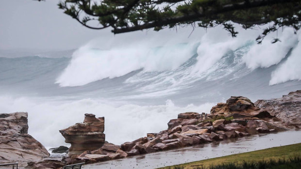 Massive waves slam the NSW coast as a deep low pressure system churns up the Tasman Sea.