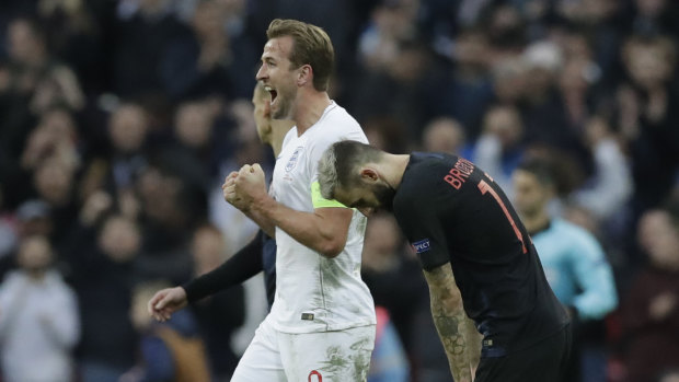 Delight: England captain Harry Kane scores the winner at Wembley.