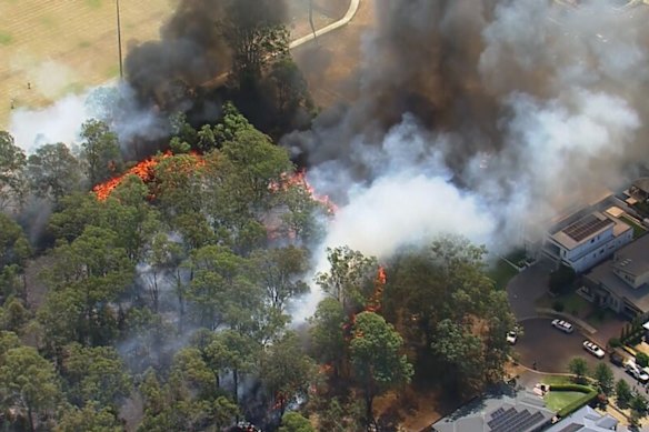 The fire broke out near homes at Kellyville in Sydney’s north-west.