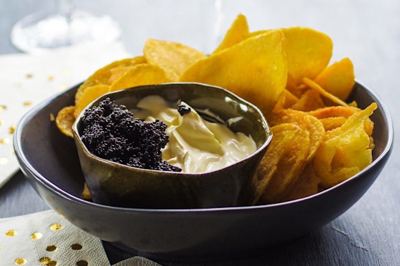 Kettle chips with champagne creme fraiche and caviar.