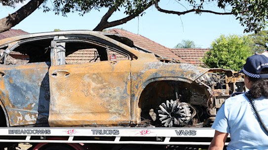A car is removed from Welfare Ave North in Beverly Hills after a dead body of a woman was found inside. 