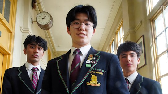 Melbourne High School students Vraj Shah (left), Aaron Zhang and
Harry Hermann.